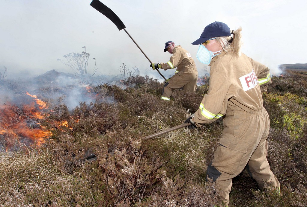 Two NIFRS Firefighters dealing with a wildfire