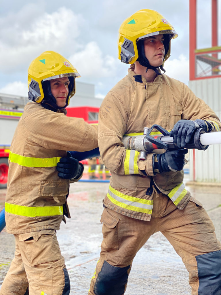 NIFRS Firefighters on drill yard.