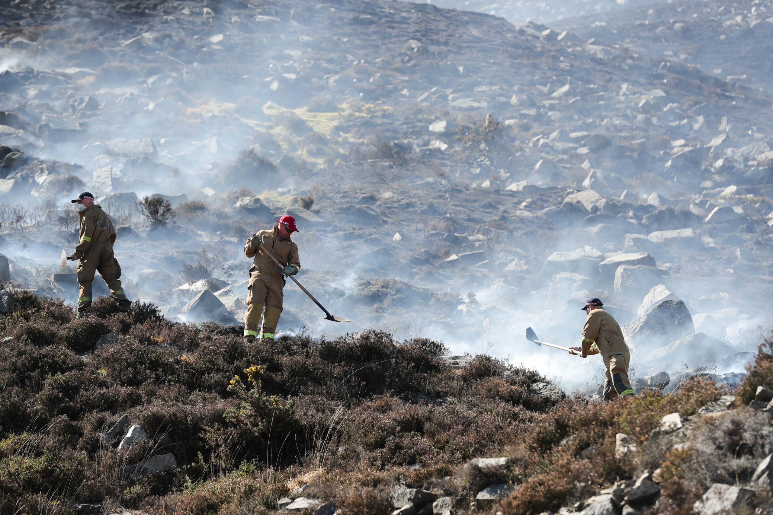 Firefighters tackle a wildfire
