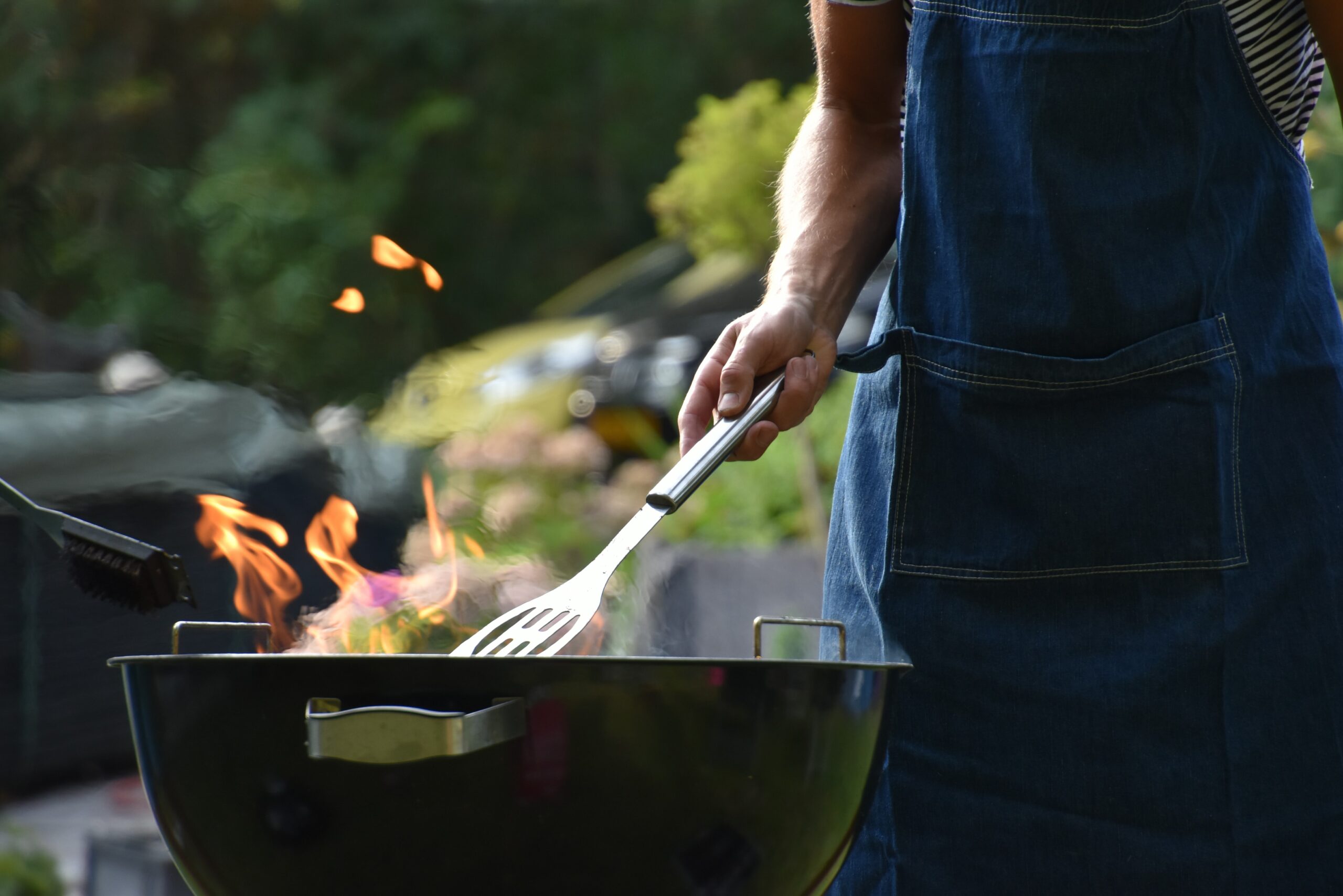 Image of someone cooking on a Barbecue