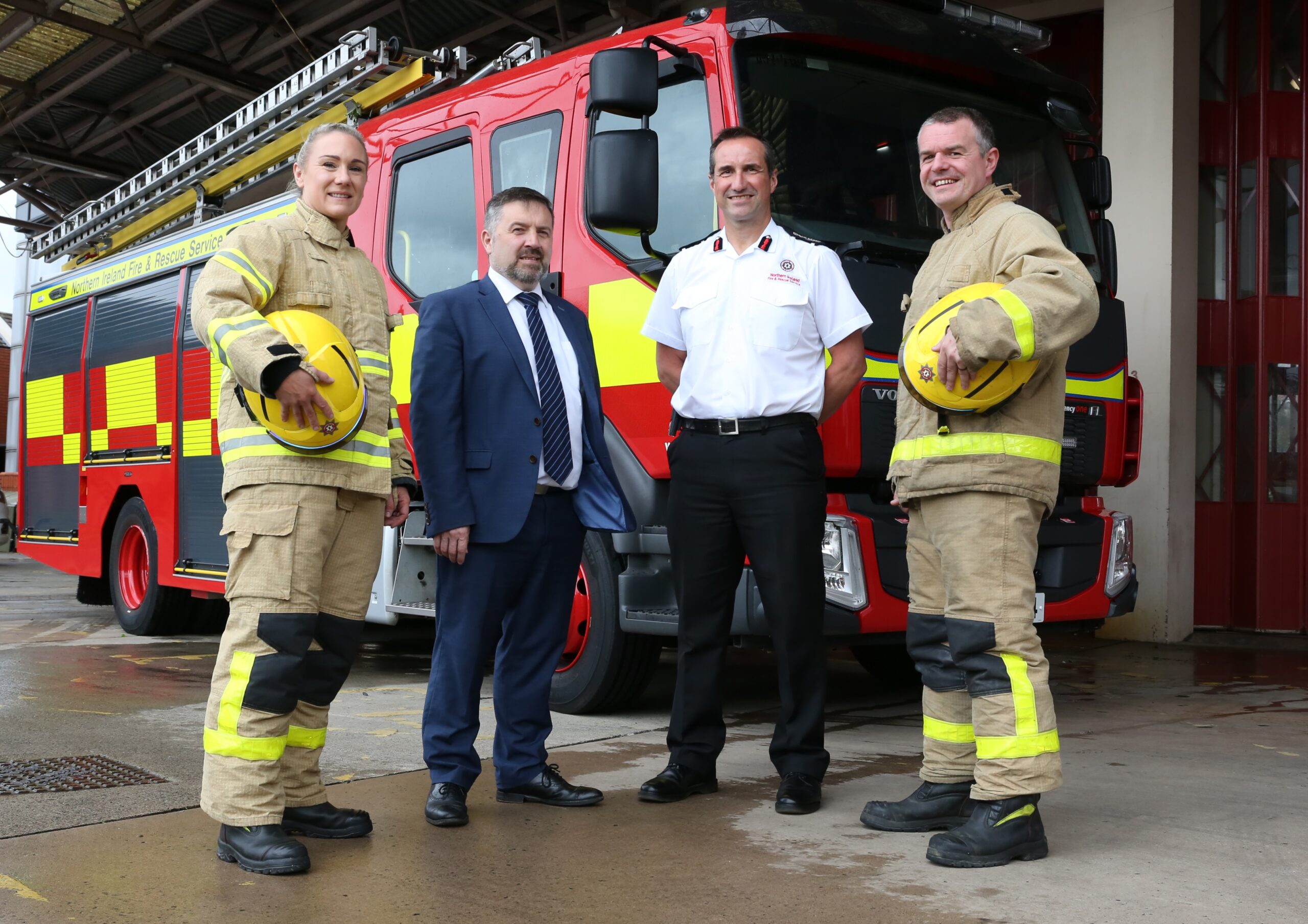 Firefighters with Minister Robin Swann and CFRO Andy Hearn