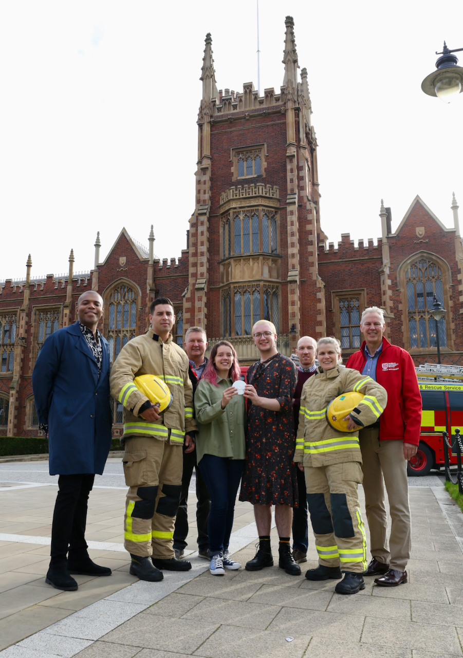 This image is taken in front of QUB and shows students and Firefighters