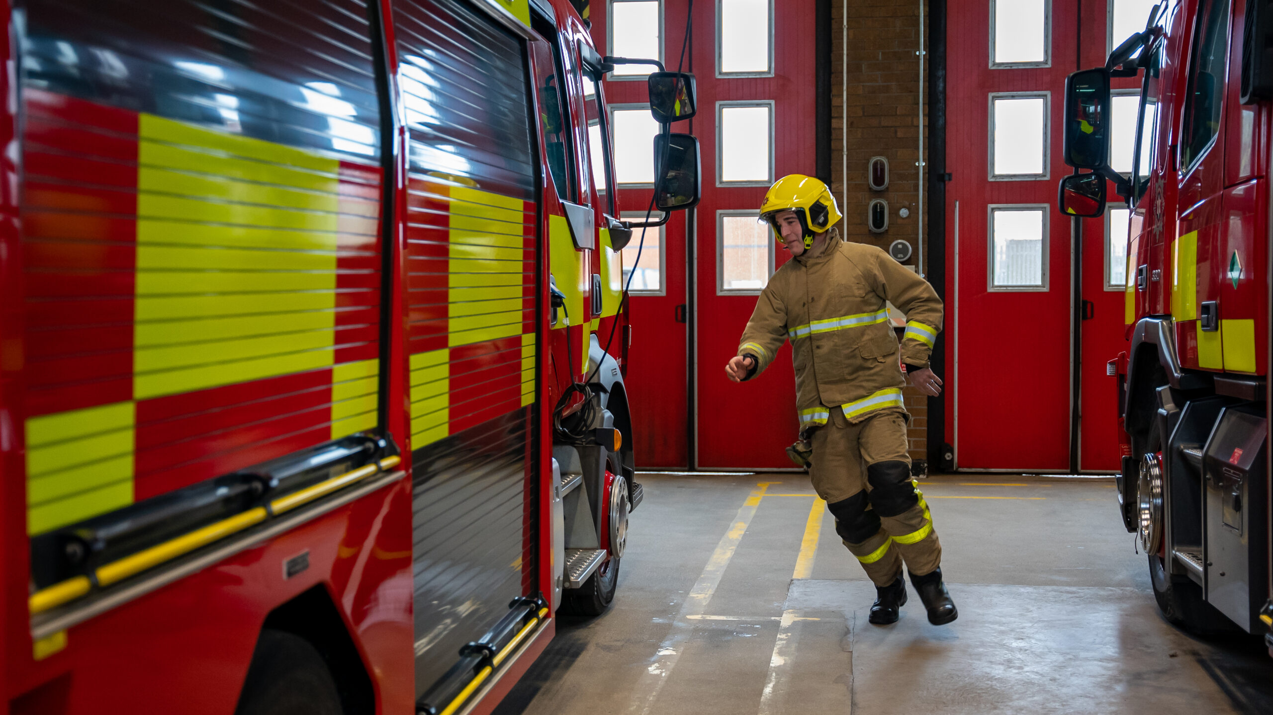 An NIFRS Firefighter rushes to a Fire Appliance. False alarms lead to unnecessary call-outs for our fire crews.
