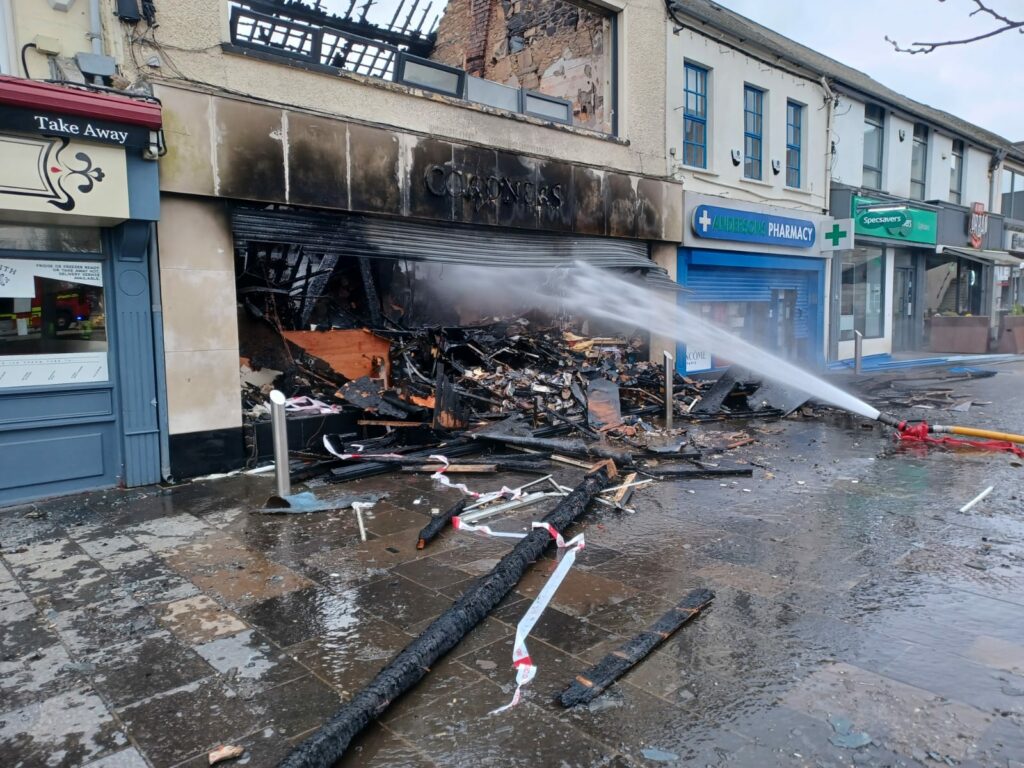 This image shows Firefighters using water jets to deal with a fire at a commercial premises in Conway Square in Newtownards
